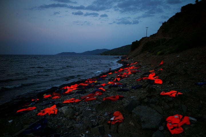 Orange life vests litter the shores of Lesbos, Greece. Over the last year, the small island has seen hundreds of thousands of refugees and migrants arrive on its shores.