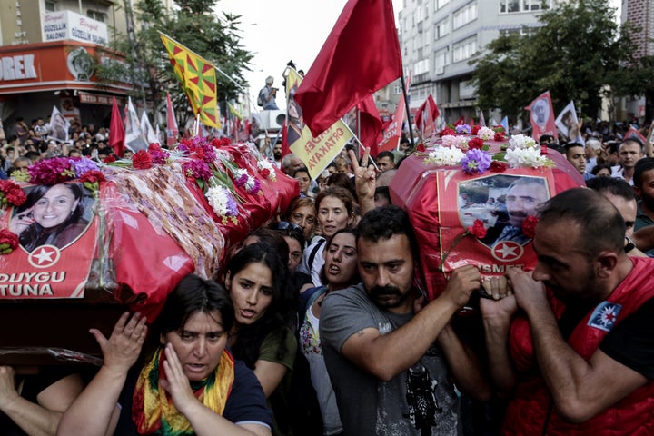 Mourners in Istanbul, Turkey, carry the coffins of two victims of the attack on the Turkish town of Suruc, on July 22, 2015.