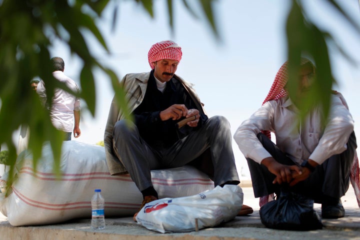 Syrian refugees in Sanliurfa, Turkey, wait to return to the Sunni Arab town of Tal Abyad on June 17, 2015, after Syrian Kurdish forces freed it from from the Islamic State group.