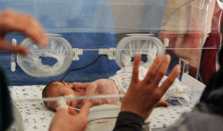 DARKOUSH, SYRIA - APRIL 22 (SOUTH AFRICA OUT): Baby Mohammed Al Khalaf at the Gift of the Givers hospital on April 22, 2013, in Darkoush, Syria. The baby was born at 30 weeks and had to flee the hospital where she was born with her mother when the Syrian government attacked the city. During the last 8 days, 45 South African medical personnel have provided medical care to 4000 Syrians. Their mission draws to a close at the end of April 2013.