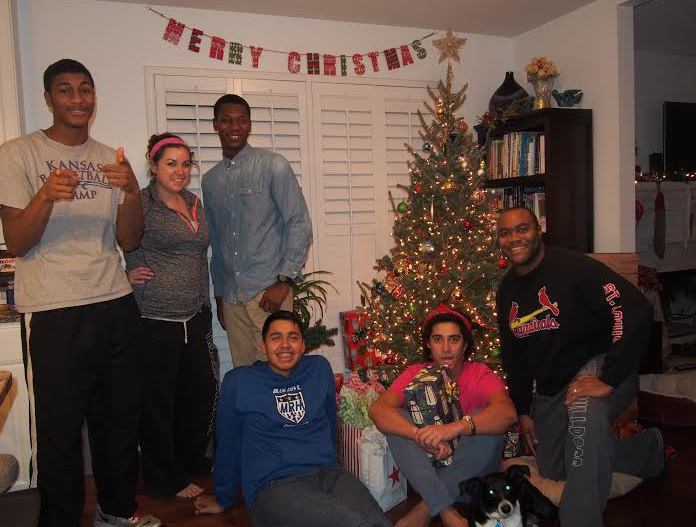 Students and house parents celebrating Christmas at Joe's Place during the 2014 - 2015 school year.