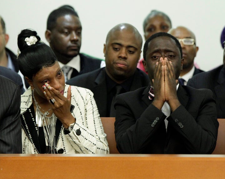 Constance Malcolm and Frank Graham, parents of Ramarley Graham, weep during the arraignment of Officer Richard Haste. As it became clear the judge was about to rule in the officer's favor, Graham's mother cursed and screamed, "They killed my child!"