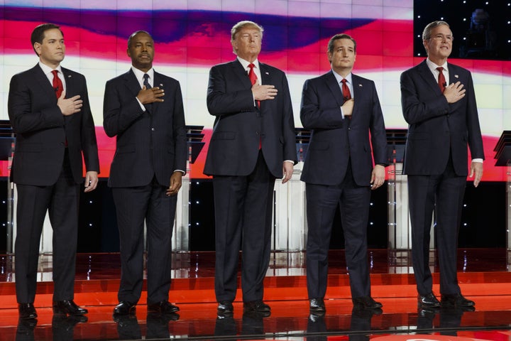 2016 Republican presidential candidatesstand on stage during the pledge of allegiance at the start of the Republican presidential candidate debate at The Venetian in Las Vegas on Dec. 15.