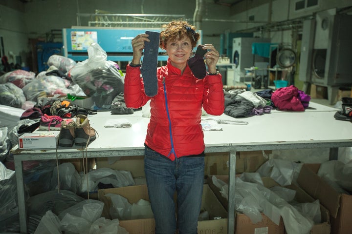 Sorting laundry that was collected from the beach in Lesbos.