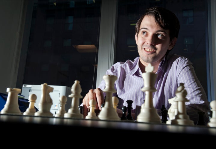 Martin Shkreli, chief investment officer of MSMB Capital Management, sits behind a chess board in New York, U.S., on Wednesday, Aug. 10, 2011. MSMB made an unsolicited $378 million takeover bid for Amag Pharmaceuticals Inc. and said it will fire the drugmaker's top management if successful.