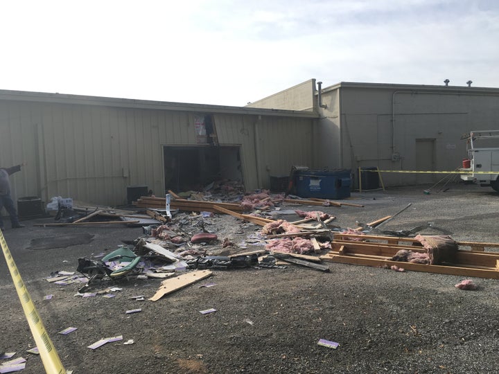 Debris from behind the Advance Tax Services business, where the collision occured, is seen.