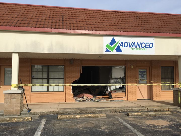 Police say a Tennessee man drove his car straight through a Florida business, later telling officers that he was trying to "enter a time portal."