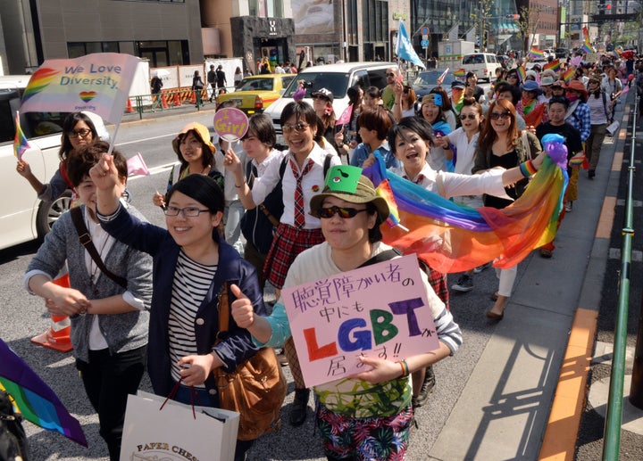 Supporters of the lesbian, gay, bisexual and transgender community march to take part in the Tokyo Rainbow Pride parade in Tokyo on April 27, 2014.