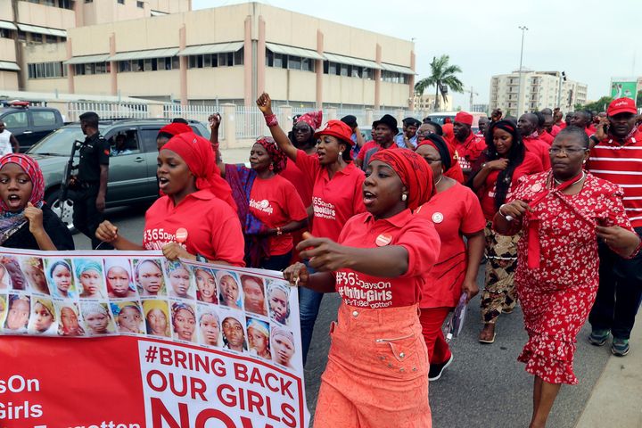 Members of the Bring Back Our Girls group campaigning for the release of the Chibok schoolgirls kidnapped by Boko Haram Islamists march to meet with the Nigerian president in Abuja, on July 8, 2015. Members of the BringBackOurGirls campaign group marched on July 8 to meet President Mohammadu Buhari to pressure him to end the deadly Boko Haram insurgency and free 219 schoolgirls held by the group since April 2014.