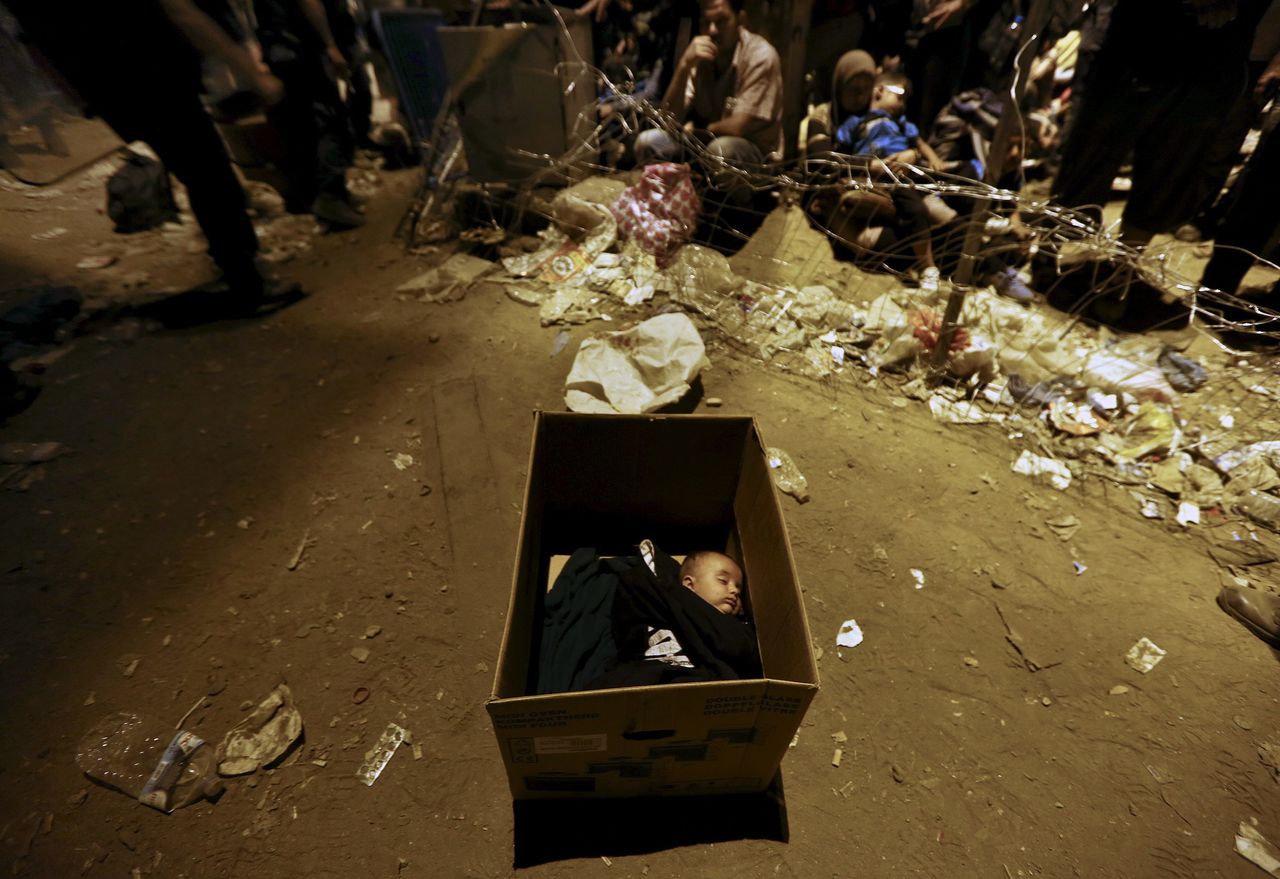 Yannis Behrakis' images have captured some of the most heart-wrenching aspects of the crisis.