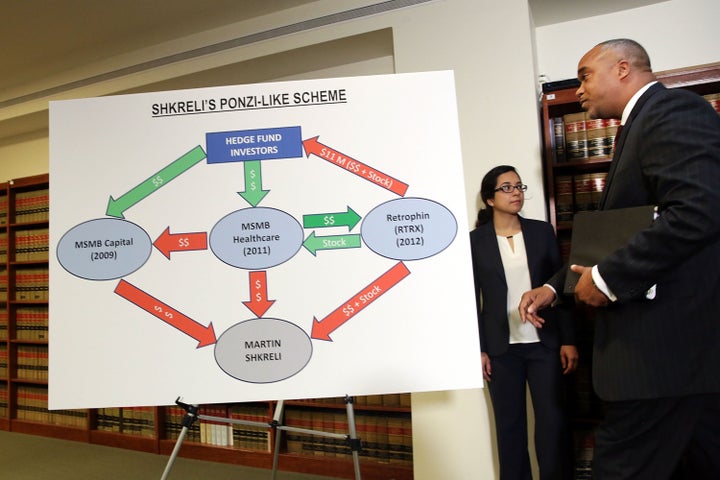 Robert Capers, U.S. Attorney for the Eastern District, walks by a story board following a news conference after the arrest of