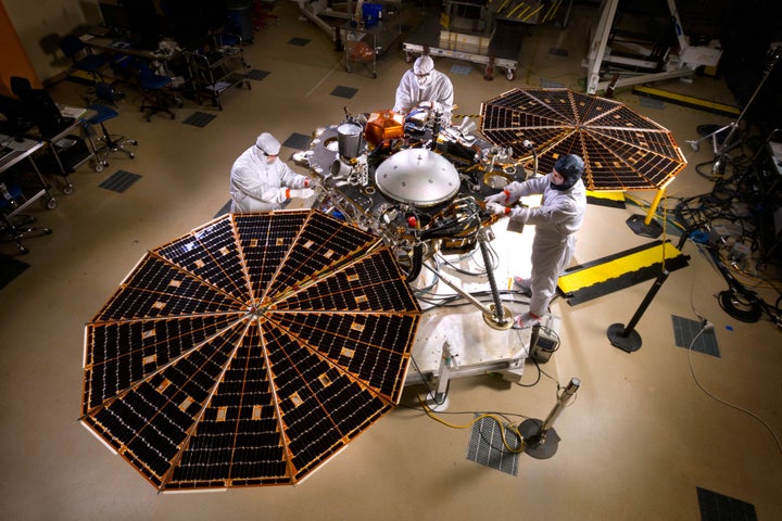 The solar arrays on NASA's InSight lander are deployed during a test conducted in a clean room at Lockheed Martin Space Systems in Denver.