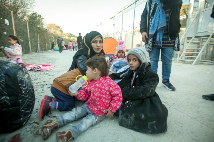 "I recognize a number of people from the boat. Sitting in the middle of the road is a beautiful woman with four very small children," Sarandon writes.