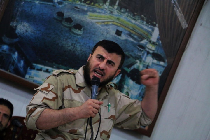 Zahran Alloush, head of the Jaish al-Islam (Islam Army) Syrian rebel group, speaks during the wedding of a fighter in the group on July 21, 2015, in the rebel-held town of Douma, on the eastern edges of the Syrian capital Damascus.