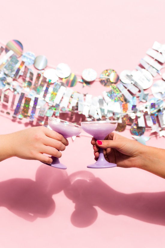 Learn how to DIY this holographic NYE garland at <a href="http://www.papernstitchblog.com/2015/12/14/holographic-new-years-eve-garland-diy-and-photo-booth-backdrop/" target="_blank">Paper & Stitch</a>. 