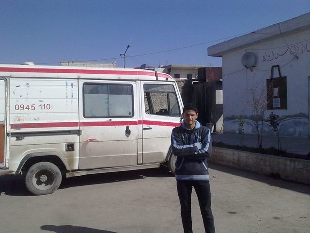 Ihaab Houriyya, Mohammad's brother, stands outside the Civil Defense base of operations in Aleppo.