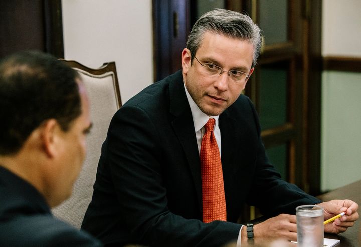 Alejandro Garcia Padilla, governor of Puerto Rico, right, speaks during a meeting with Senator Carmelo Rios at the Governor's Mansion, known as La Fortaleza, in San Juan, Puerto Rico, on Tuesday, July 7, 2015.