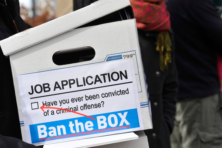 Activists deliver a petition to the White House on Oct. 26, 2014, calling to "ban the box" that requires job applicants to state whether they have a criminal record.