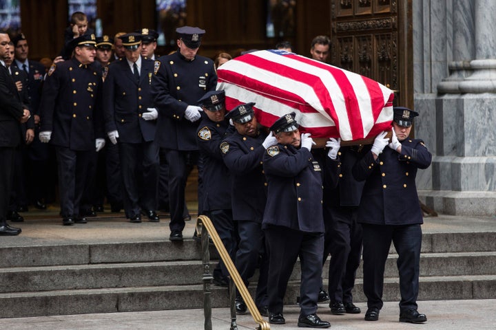 The casket carrying Joseph Lemm is carried out of St. Patrick's Cathedral.