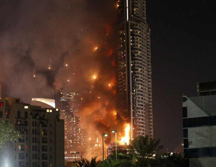 The Address Downtown Dubai hotel stands across the famous Burj Khalifa tower. 