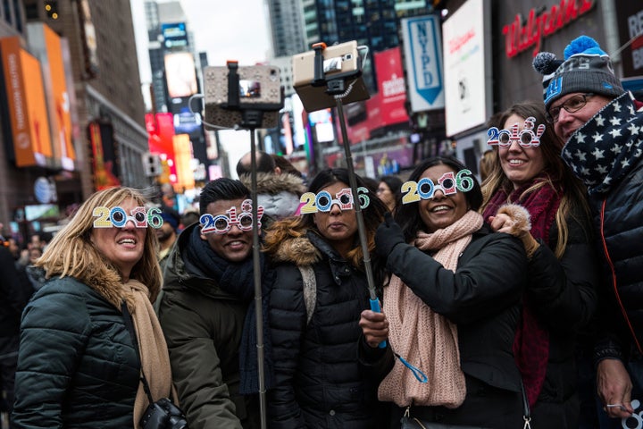 Tourists from Holland take a selfie while waiting to celebrate new years in Times Square on Thursday.