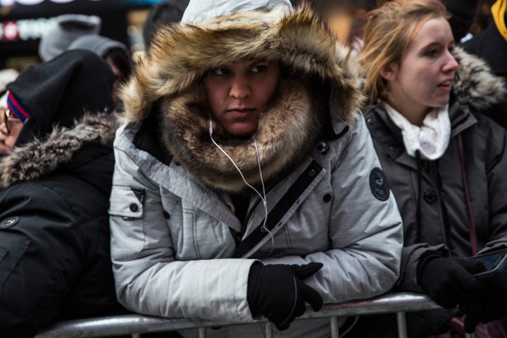 Once attendees, like the one seen here, pass through police checks, they cannot leave their viewing area without going through the security process again.