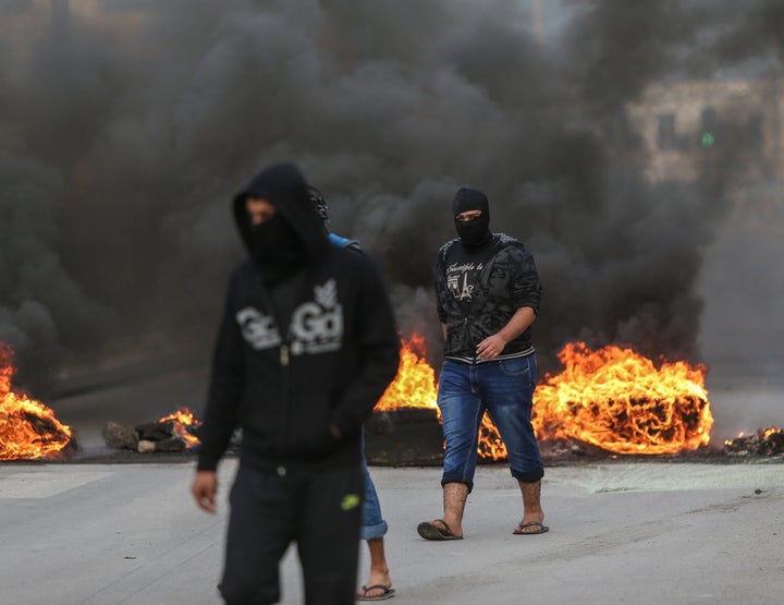 Demonstrators burn tires during a protest, against the execution of prominent Shiite cleric Nimr al-Nimr by Saudi authorities