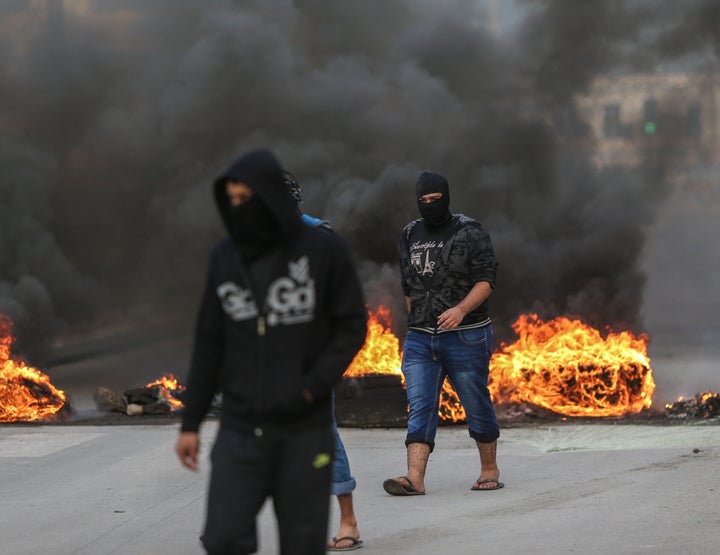 Demonstrators burn tires during a protest, against the execution of prominent Shiite cleric Nimr al-Nimr by Saudi authorities, in Manama, Bahrain on January 2, 2016.