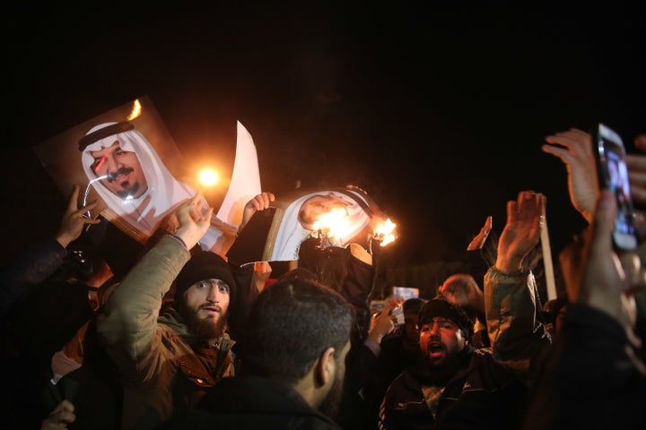 Iranian protesters gather outside the Saudi Embassy in Tehran during a demonstration against the execution of prominent Shiite Muslim cleric Nimr al-Nimr by Saudi authorities, on January 2, 2016.