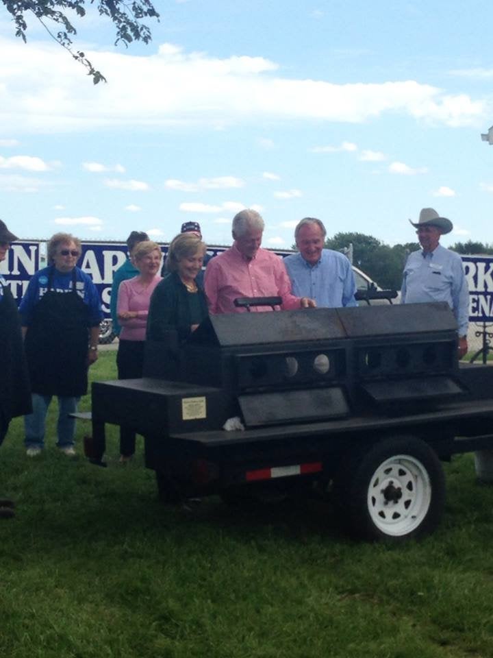 Hillary and Bill Clinton flip steaks alongside former Sen. Tom Harkin (D-Iowa) at his last Steak Fry on Sept. 15, 2014, even