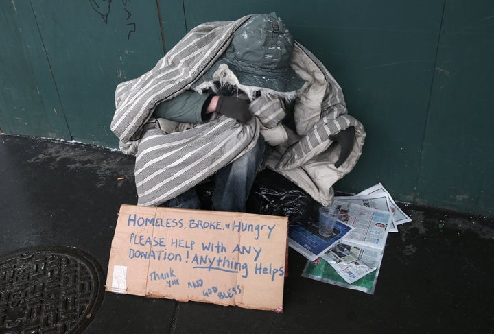 A homeless person bundles against the cold during a snowstorm on January 21, 2014 in New York City.