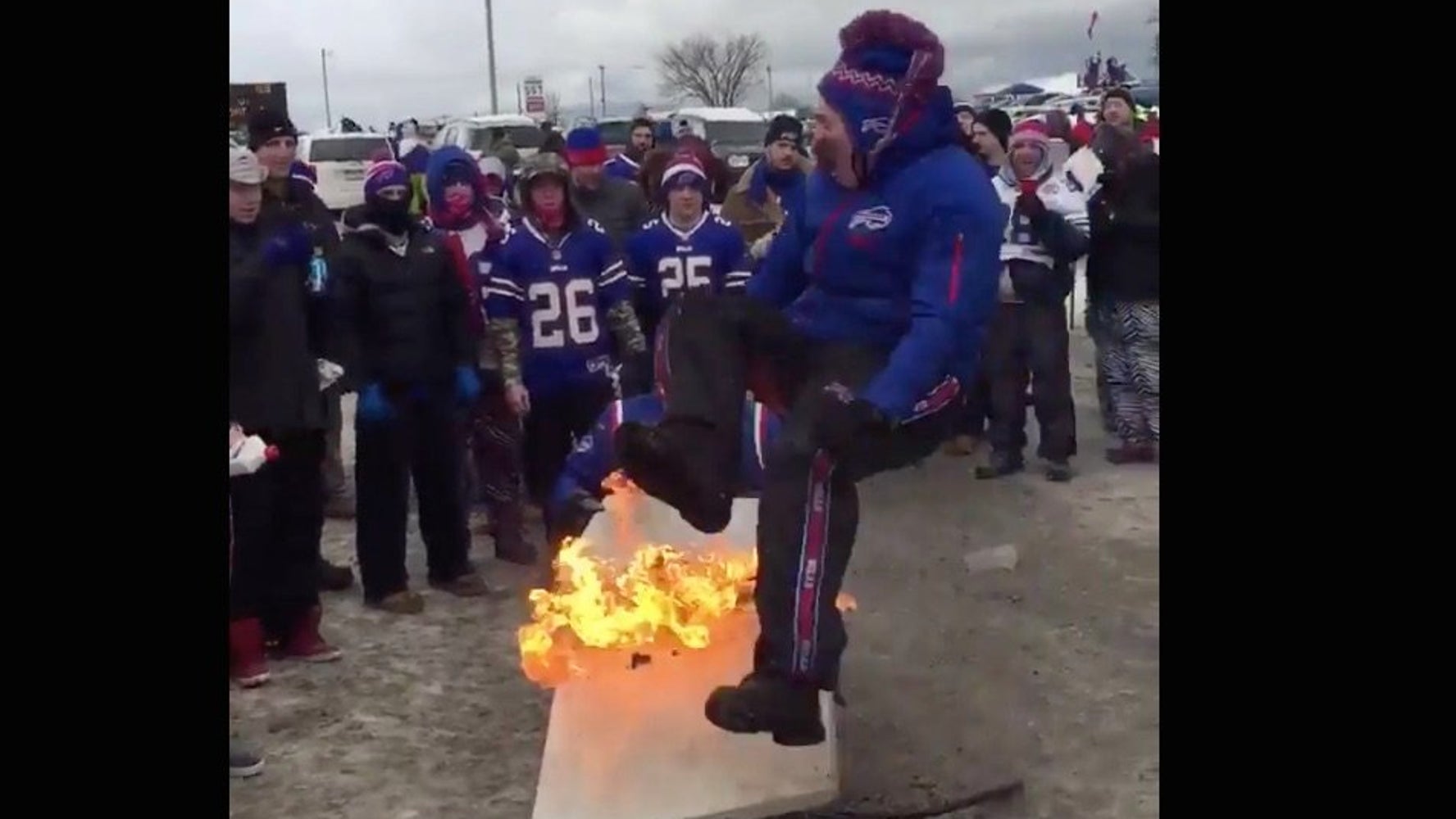 OOPS! Buffalo Bills Fan Sets Himself On Fire Attacking A Table At