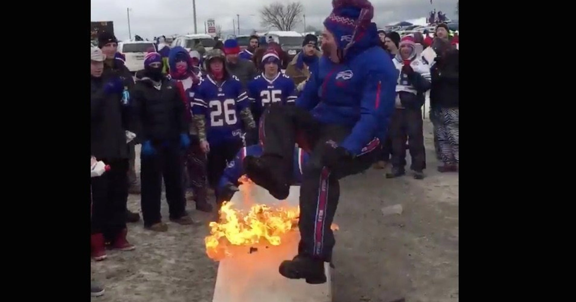 OOPS! Buffalo Bills Fan Sets Himself On Fire Attacking A Table At