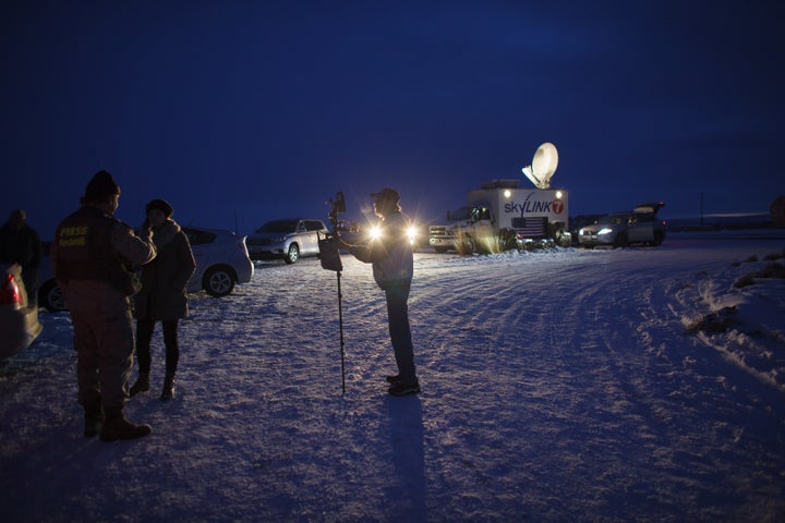 Media gather outside the entrance of the Malheur Wildlife Refuge Headquarters near Burns, Oregon, Jan. 3, 2016, where an armed anti-government group have taken over a building at the federal wildlife refuge, accusing officials of unfairly punishing ranchers who refused to sell their land.