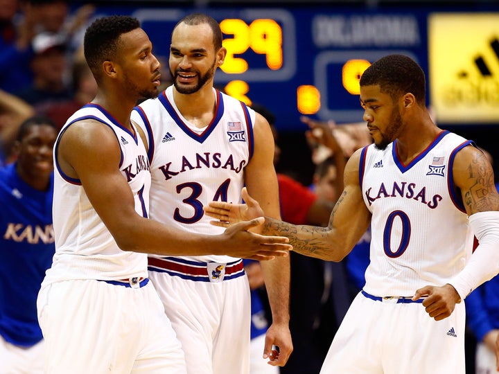 Wayne Selden Jr., Perry Ellis and Frank Mason III celebrate late in the game against Oklahoma at Allen Fieldhouse on Jan