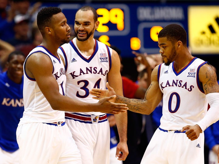 Wayne Selden Jr., Perry Ellis and Frank Mason III celebrate late in the game against Oklahoma at Allen Fieldhouse on Jan. 4, 2016.