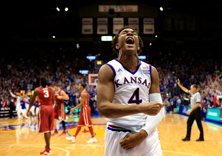 Kansas' Devonte' Graham celebrates as the Jayhawks defeat the Oklahoma Sooners, 109-106, at Allen Fieldhouse on Jan. 4, 2016 in Lawrence, Kansas.