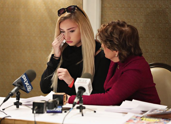 Molly O'Malia is comforted by her lawyer Gloria Allred during a press conference on Jan. 4. 