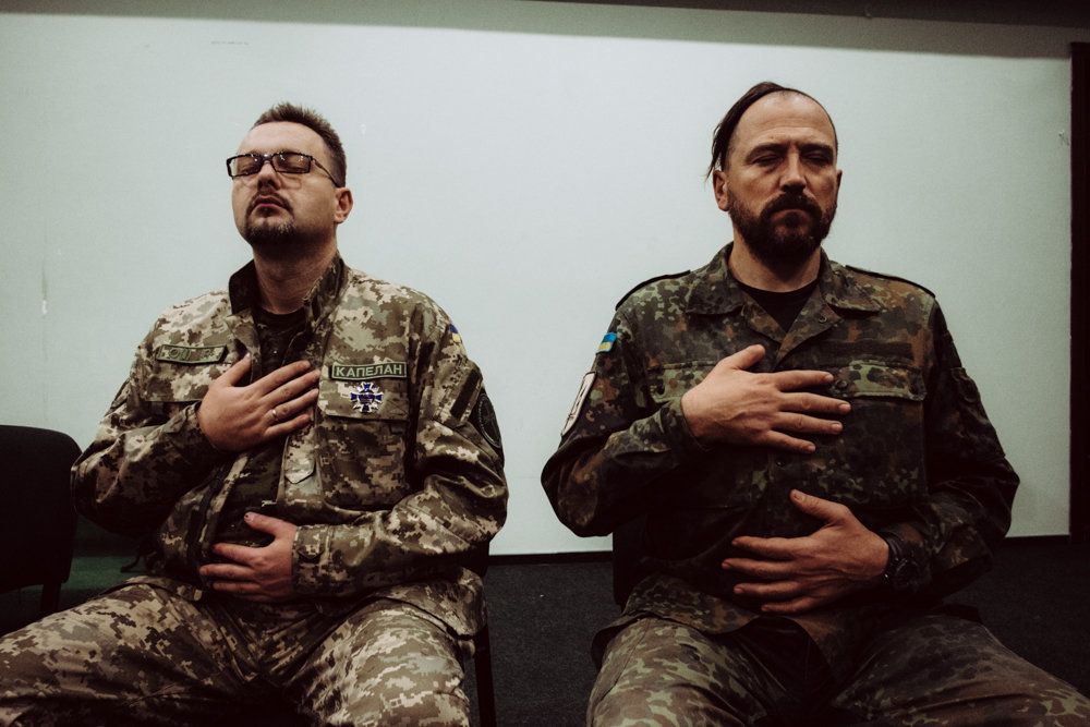 Participants take part in breathing exercises at a PTSD seminar offered by Wounded Warrior Ukraine, a nonprofit that teaches servicemen how to become Combat Shock Trainers.
