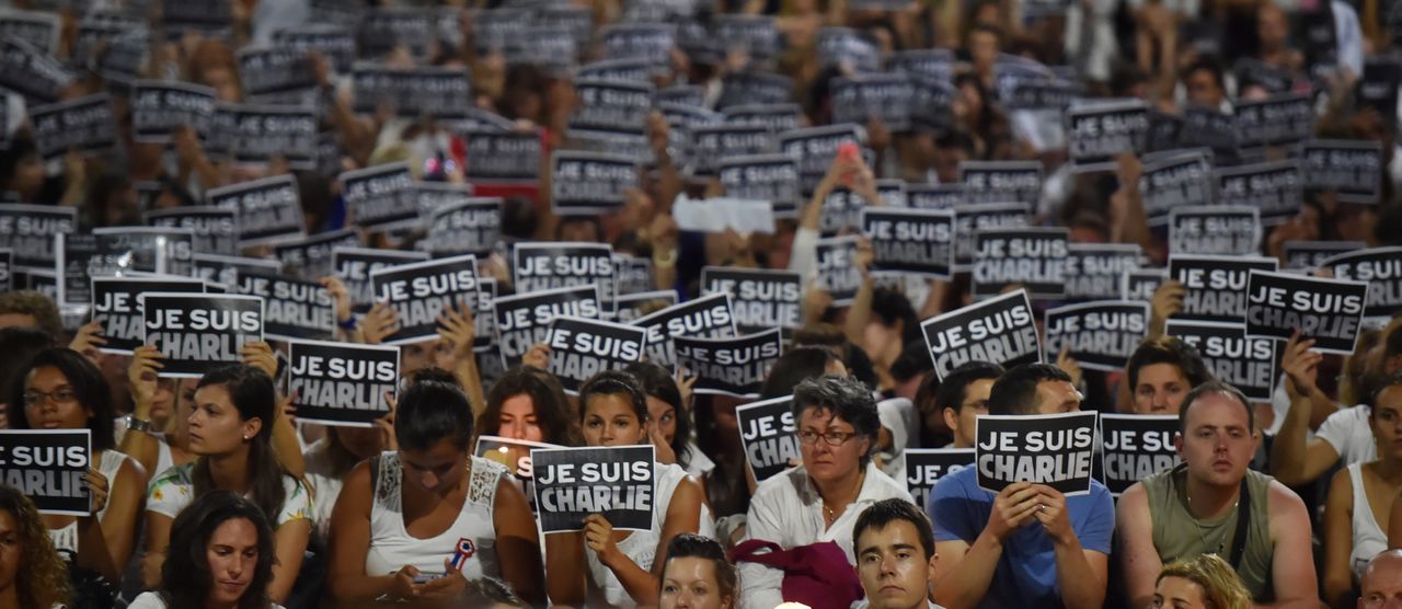 Members of Sydney's French community gather in the heart of the city to hold aloft banners reading 'Je Suis Charlie' (I am Charlie) on Jan. 8, 2015.