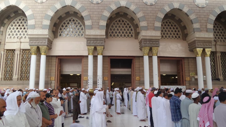 Muslim pilgrims pray at the Masjid al-Nabawi (The Prophet's Mosque), where the tomb of Prophet Mohammad is located, in Medina