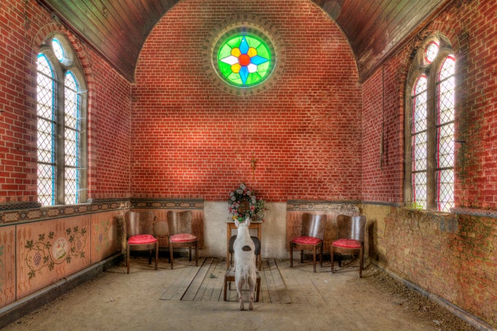 Claire praying in an abandoned chapel in Belgium.