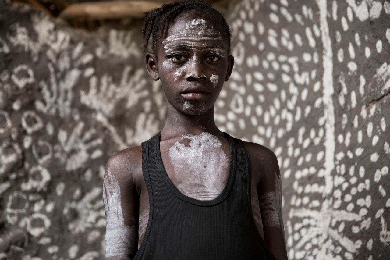 Hawa, a girl from Gbolakai-Ta who survived Ebola, asked to be photographed in the room in which she was born and almost died.