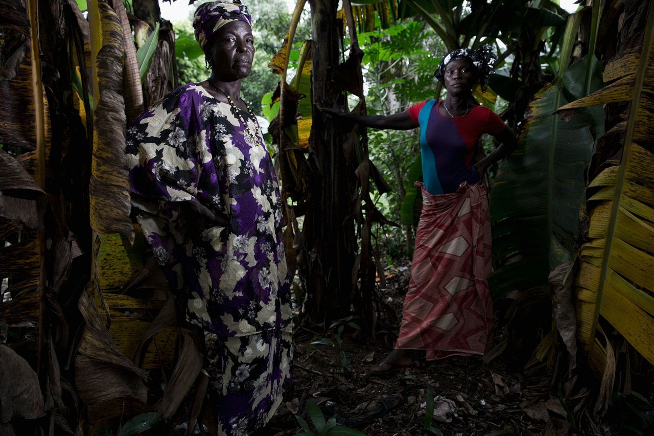Esther and Kadiatu guard the border to their village of Rosanda, Sierra Leone.