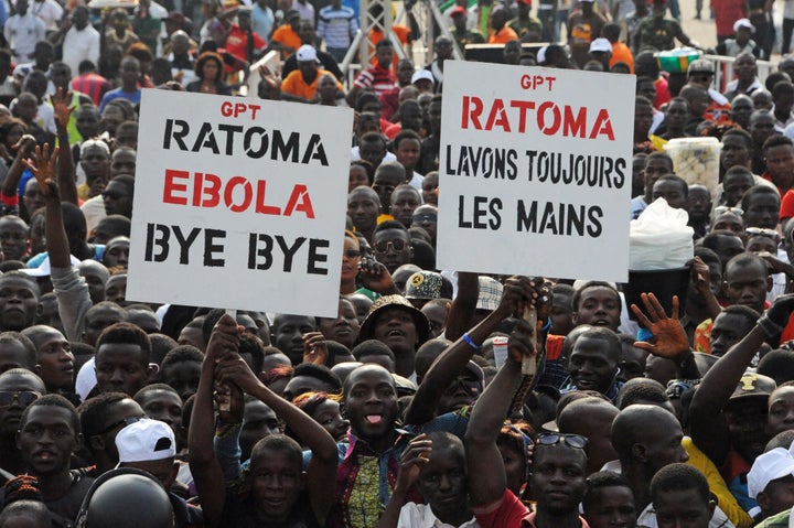 Crowds cheer during the "Bye Bye, Au Revoir Ebola" concert in Conakry Guinea, on Dec. 30, 2015.