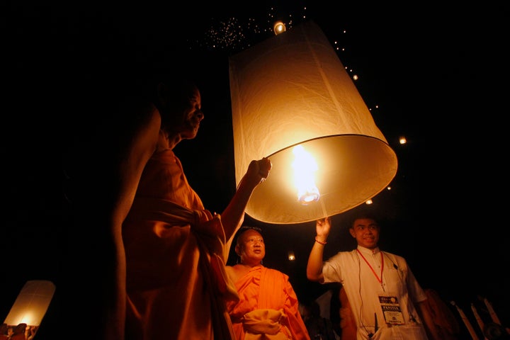 Buddhist followers release a lantern into the air at Borobudur temple during celebrations for Wesak Day.