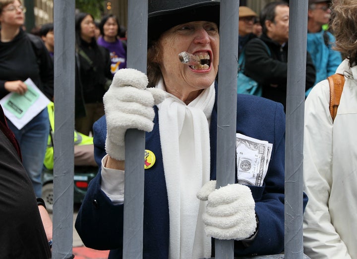 Protesters demonstrate outside a Wells Fargo Bank shareholders' meeting to make the point that no executives were jailed after the financial crisis.