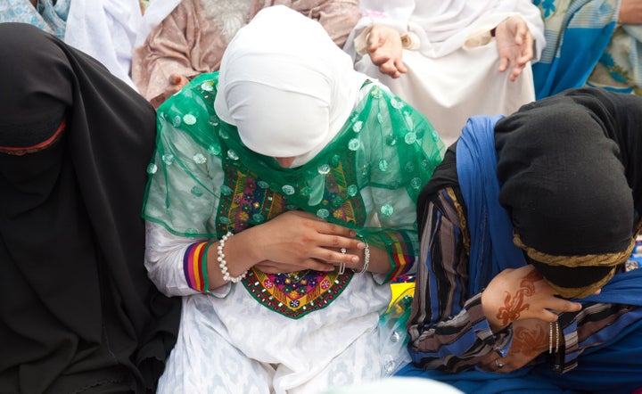 Muslim women offer congregational Eid-ul-Fitr prayers at Eid Gah in Srinagar, India.