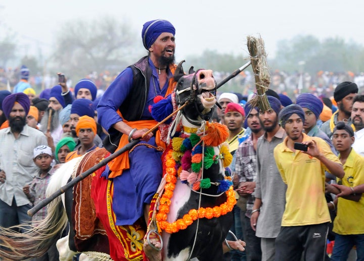 Sikh soldiers participate in a horse riding competition during Holla Mohalla celebrations in Anandpur Sahib, India.