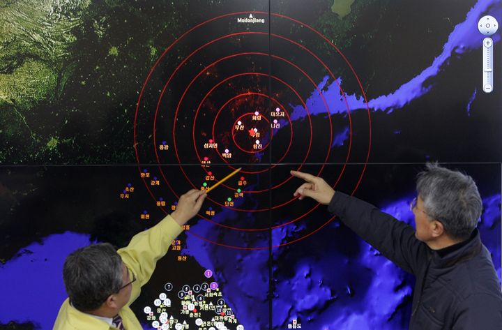Ko Yun-hwa (L), the Korea Meteorological Administration administrator, and Yun Won-Tae (R), the director general of the Earthquake and Volcano of the Korea Meteorological Administration, checks the screen of show a seismic waves from North Korea.